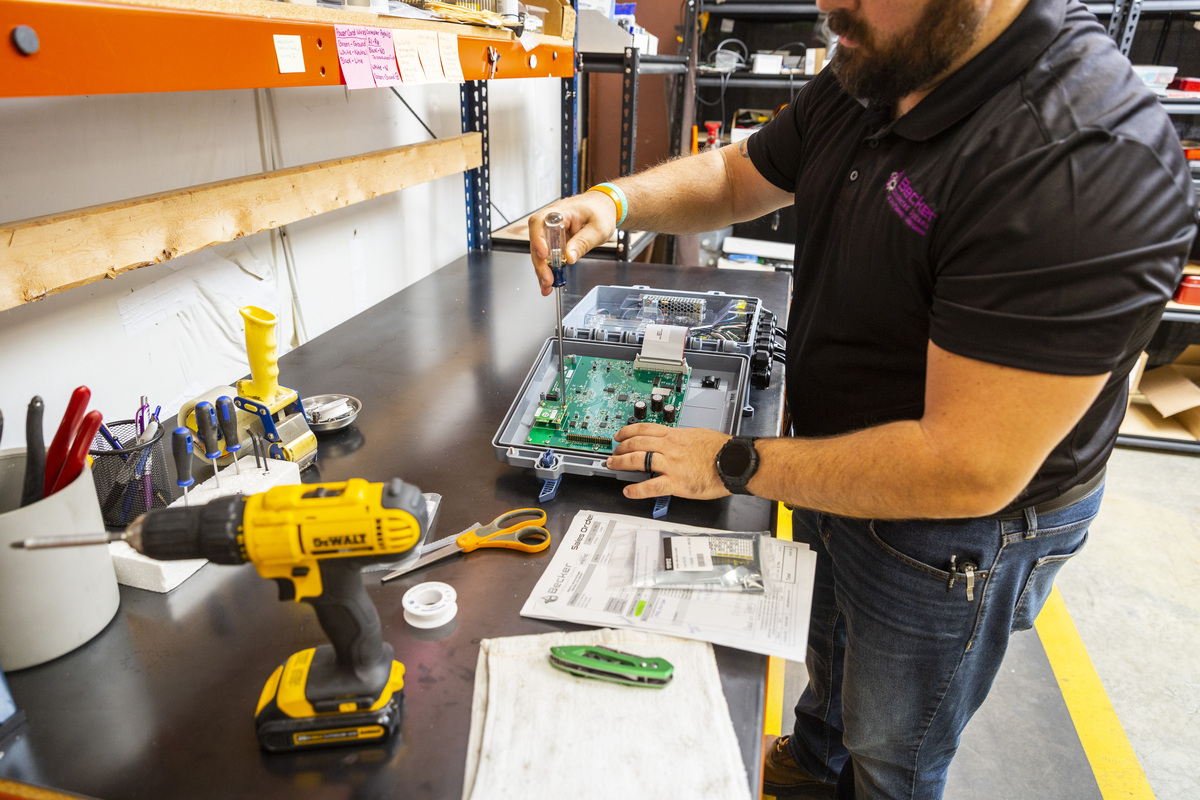 Man working on a control panel